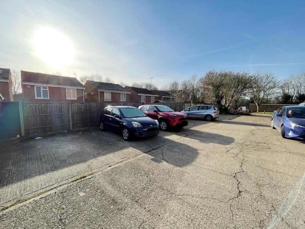 Lot: 121 - PARCEL OF LAND WITH PLANNING FOR TWO GARAGES AND NINE BOLLARD PARKING SPACES - nine bollard parking spaces in residential area in London Colney